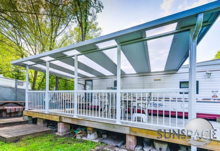 A patio cover built on a modular home provides sun protection in Northern Ohio