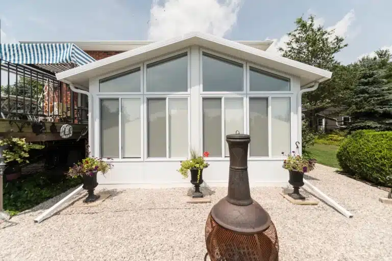 white exterior sunroom with sunshades